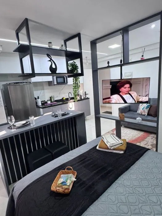 Studio mobiliado com cozinha e cama de casal — Carménère